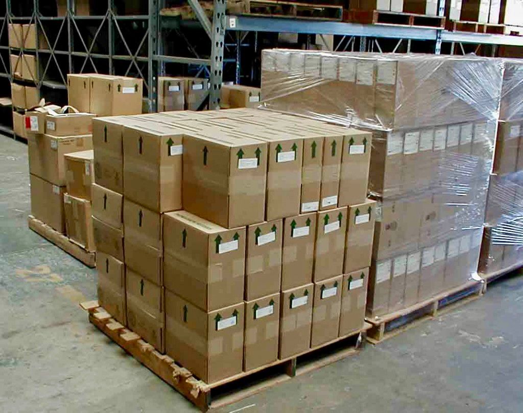 load of boxes stacked together in warehouse