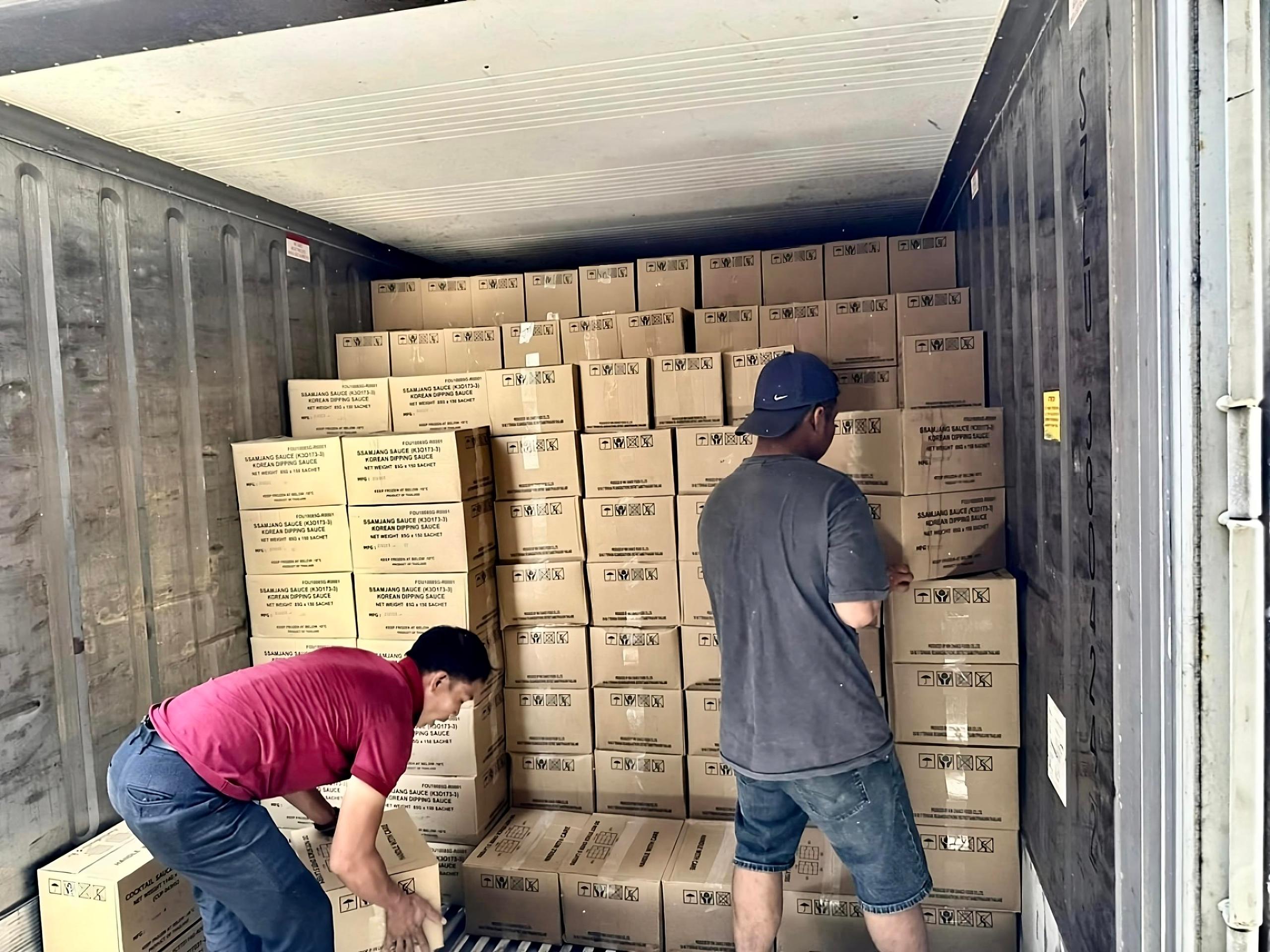 Workers loading boxes
